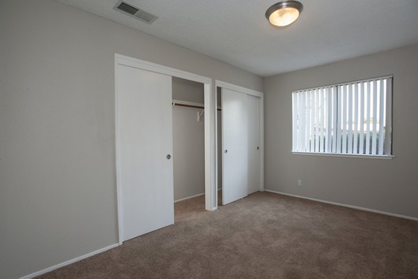 Cozy bedroom with modern decor at Sheridan Park Apartments