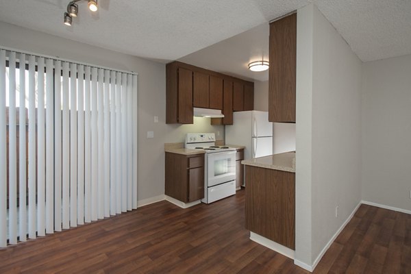 Dining room with modern furnishings and elegant lighting at Sheridan Park Apartments