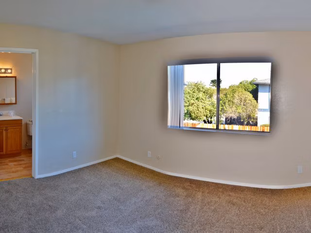 Cozy bedroom with ocean views at Marina Crescent Apartments