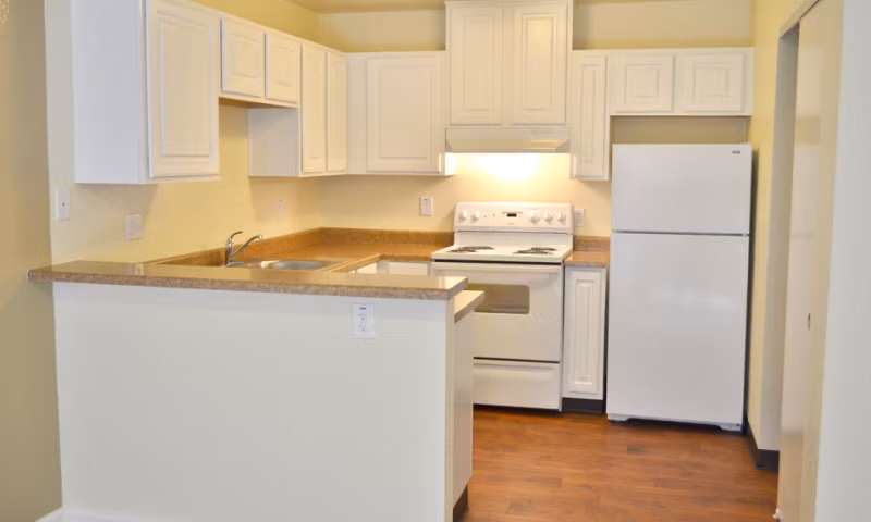 Shoreline Apartments: Modern kitchen with stainless steel appliances and granite countertops
