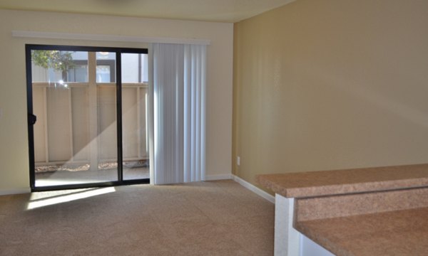 Spacious living room with modern decor and natural light at Shoreline Apartments