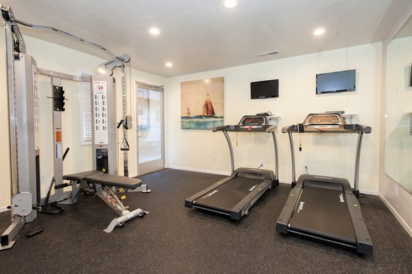 Fitness center equipped with state-of-the-art machines at Monterey Townhouse