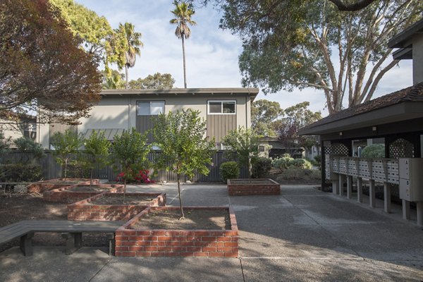 Courtyard featuring landscaped gardens at Monterey Townhouse luxury apartments