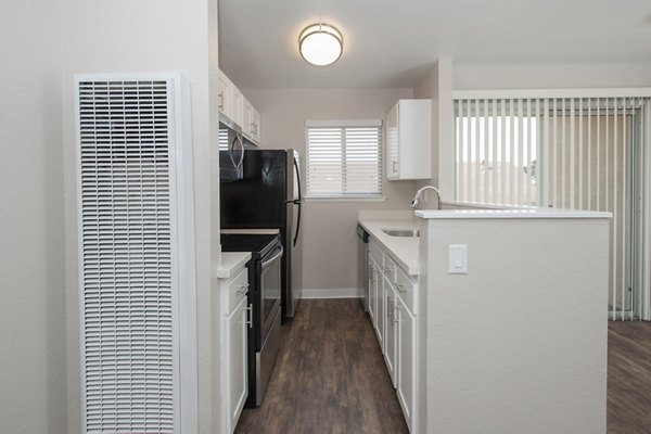 Contemporary kitchen with stainless appliances at Pacific Vista Apartments