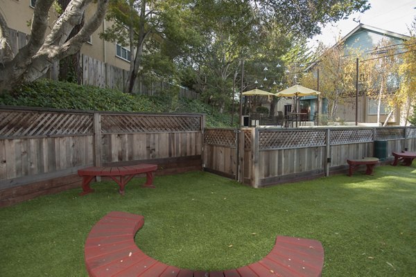 Dog park with agility equipment at Pacific Vista Apartments