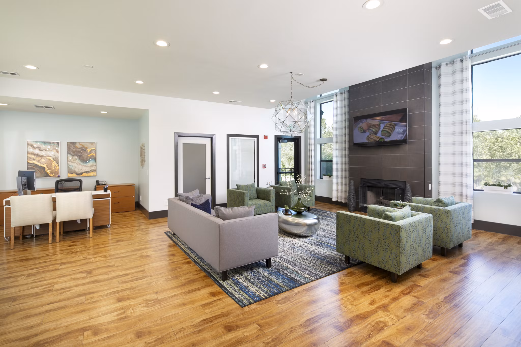 Waterscape Apartments: Stylish clubhouse with modern decor and lounging areas, ideal for social gatherings at luxury apartments