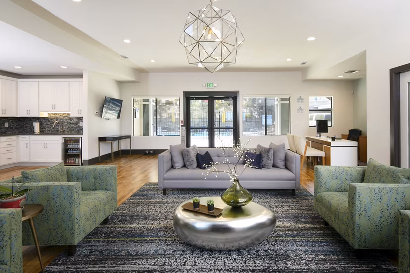 Clubhouse featuring modern design and comfortable seating at Waterscape Apartments, ideal for community gatherings and relaxation