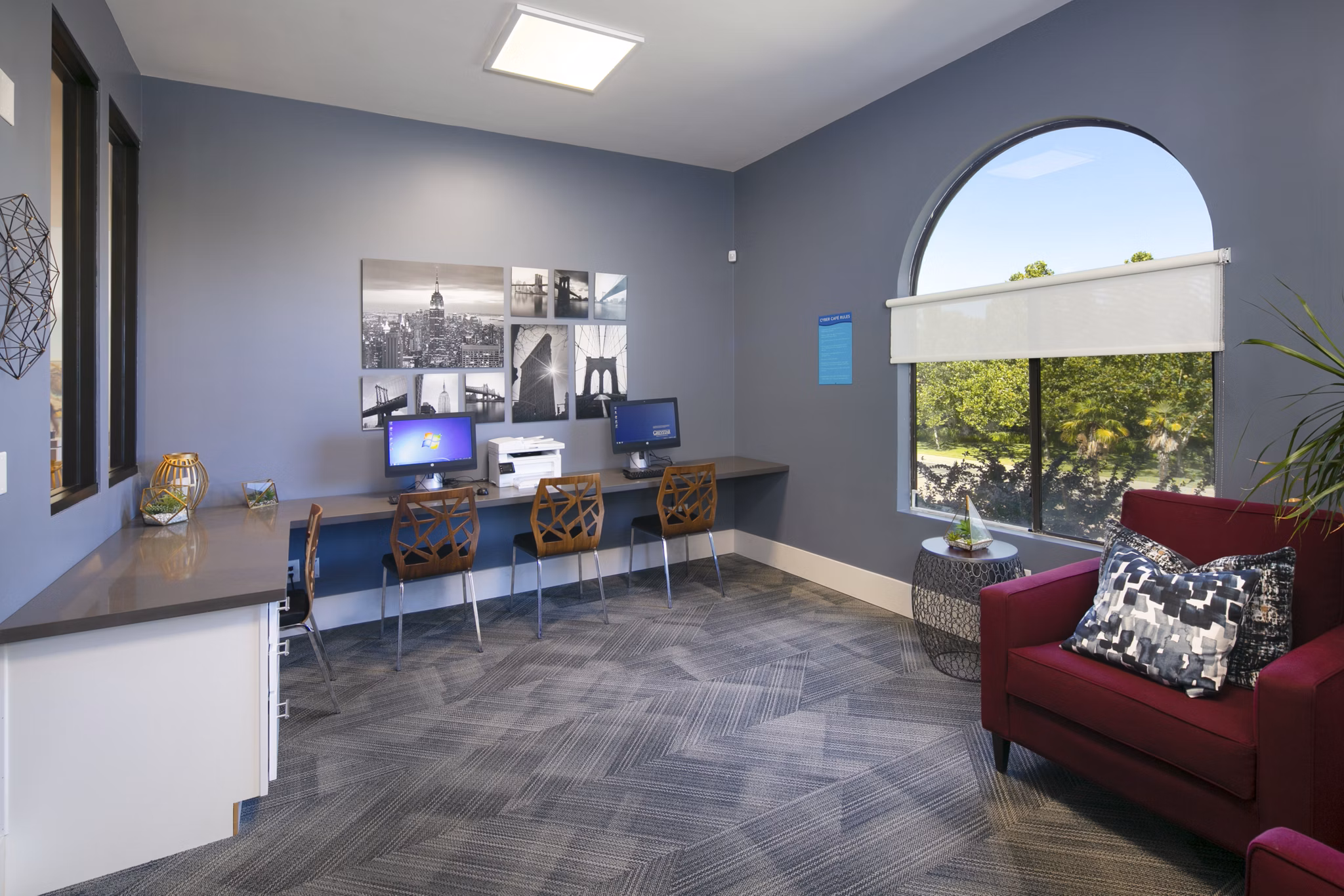 Outdoor clubhouse with comfortable seating at Waterscape Apartments, luxury living space in serene community setting