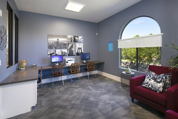 Outdoor clubhouse with comfortable seating at Waterscape Apartments, luxury living space in serene community setting