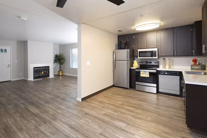 Cozy kitchen with modern appliances and granite countertops at Waterscape Apartments