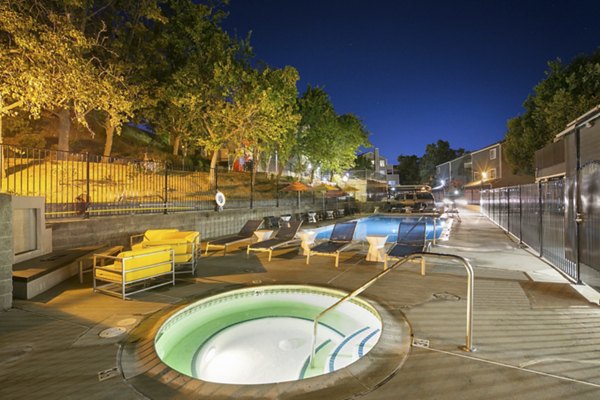 Resort-style pool with sundeck at Waterscape Apartments offering luxury living