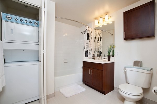 Luxurious bathroom with modern fixtures at Chancery Square Apartments, offering premium living in vibrant surroundings