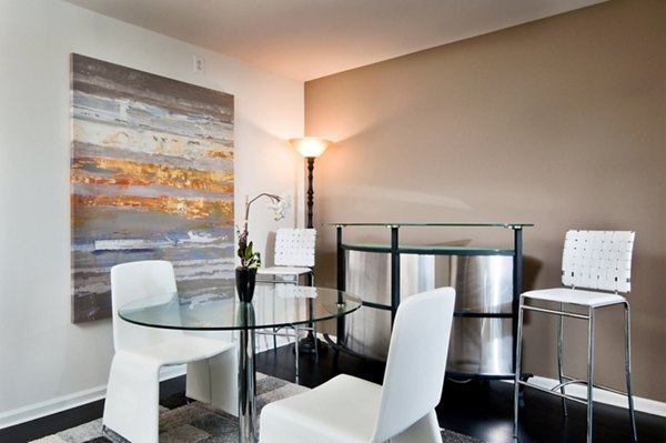 Dining area with modern decor and stylish lighting in Chancery Square Apartments