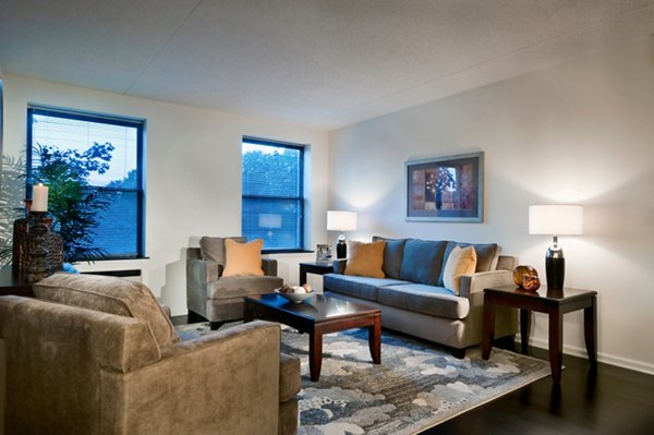 Bright living room with modern decor at Chancery Square Apartments, luxury community by Greystar