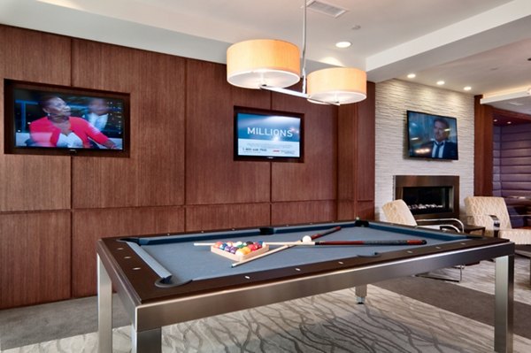 Clubhouse with modern furnishings and spacious seating area at Osprey Cove Apartments, offering luxury living in a vibrant community