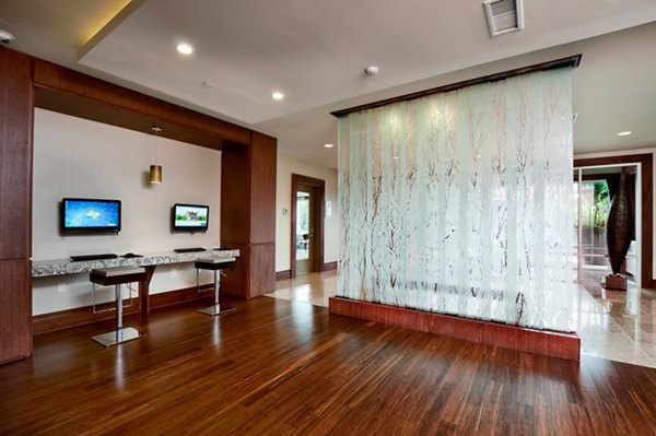 Clubhouse featuring modern design elements at Osprey Cove Apartments, offering luxury amenities and spaces for social gatherings