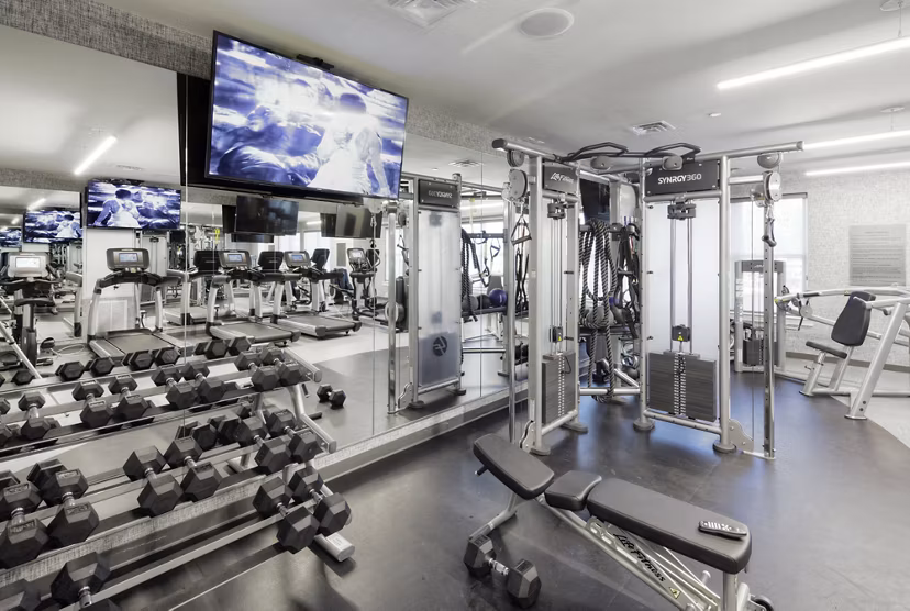 State-of-the-art fitness center with modern equipment at Osprey Cove Apartments, offering residents a premium workout experience