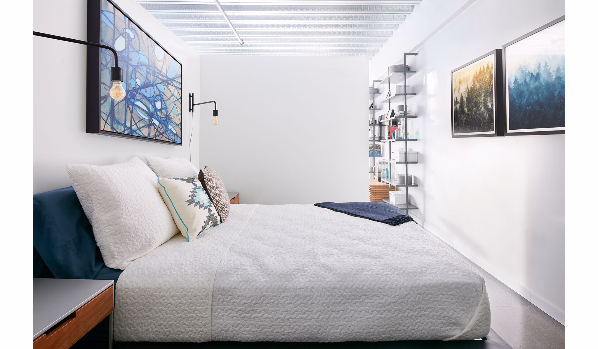 Elegant bedroom with modern decor at Watermark Seaport Apartments