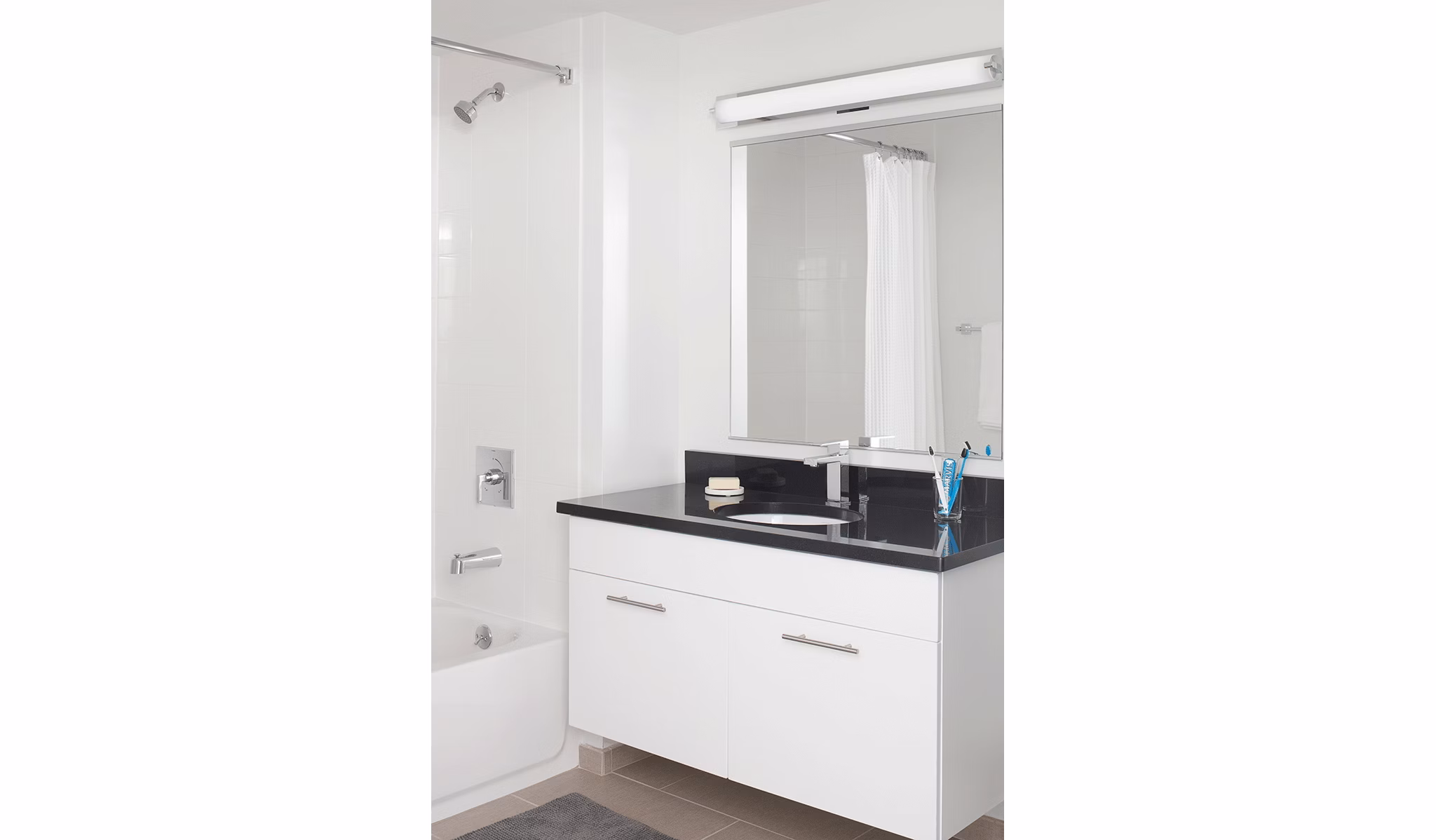 Modern bathroom with sleek fixtures at Watermark Seaport Apartments, offering luxury living in a high-end Greystar community