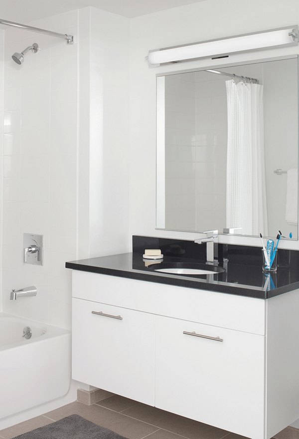 Modern bathroom with sleek fixtures at Watermark Seaport Apartments, offering luxury living in a high-end Greystar community