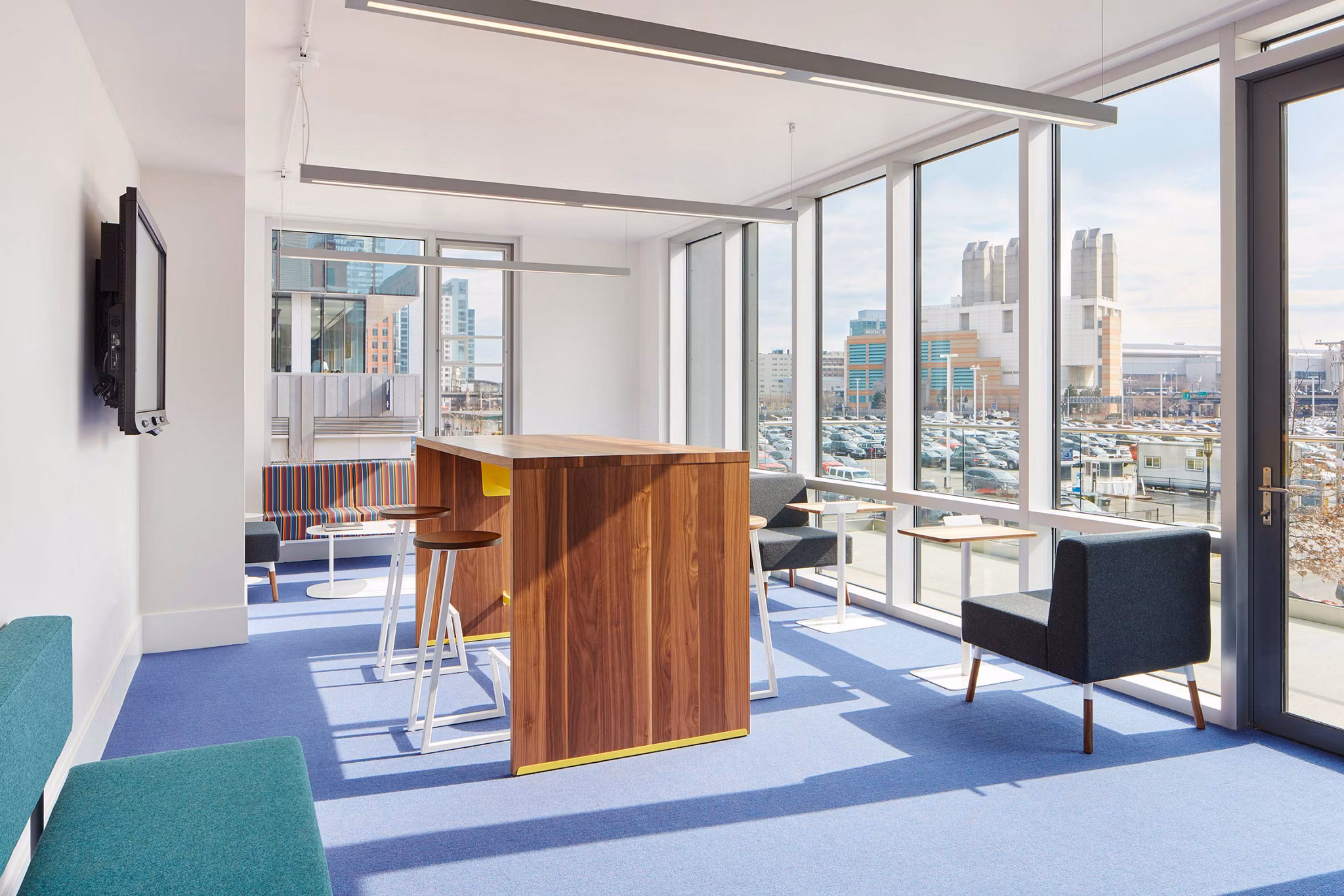 Clubhouse with modern design and ample seating at Watermark Seaport Apartments Ideal for community gatherings and events