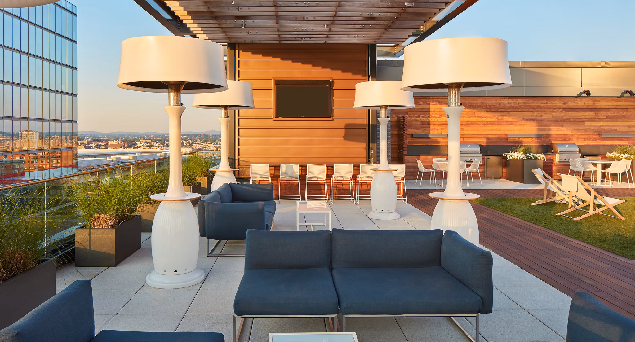 Scenic rooftop deck with city skyline views at Watermark Seaport Apartments