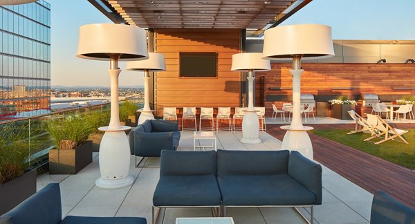Scenic rooftop deck with city skyline views at Watermark Seaport Apartments