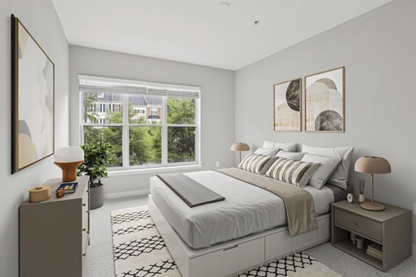 Bedroom featuring modern decor and neutral tones at Midtown at Camp Springs Apartments