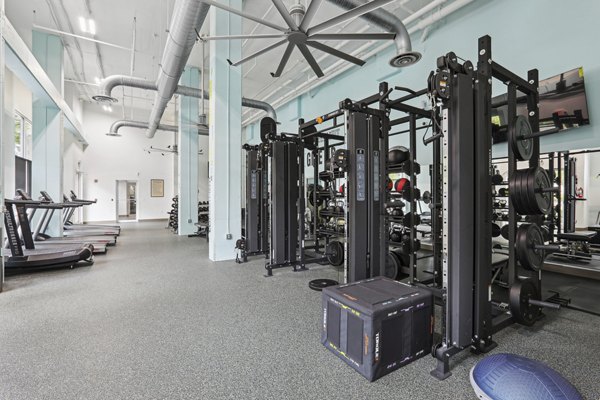 Spacious fitness center with modern equipment at Midtown at Camp Springs apartments