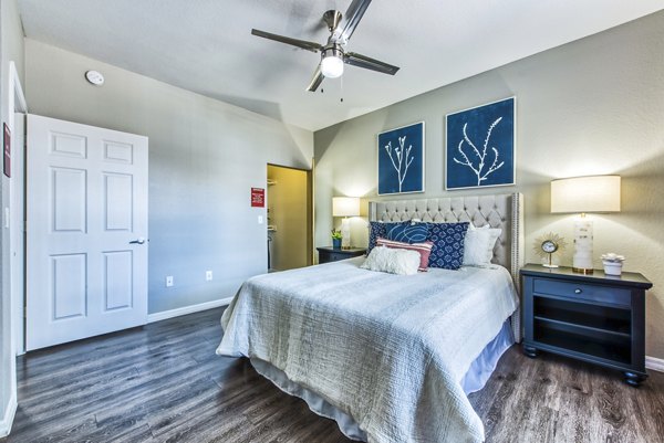 Cozy bedroom with modern furnishings at Envision Apartments, Greystar's luxury property for comfortable living