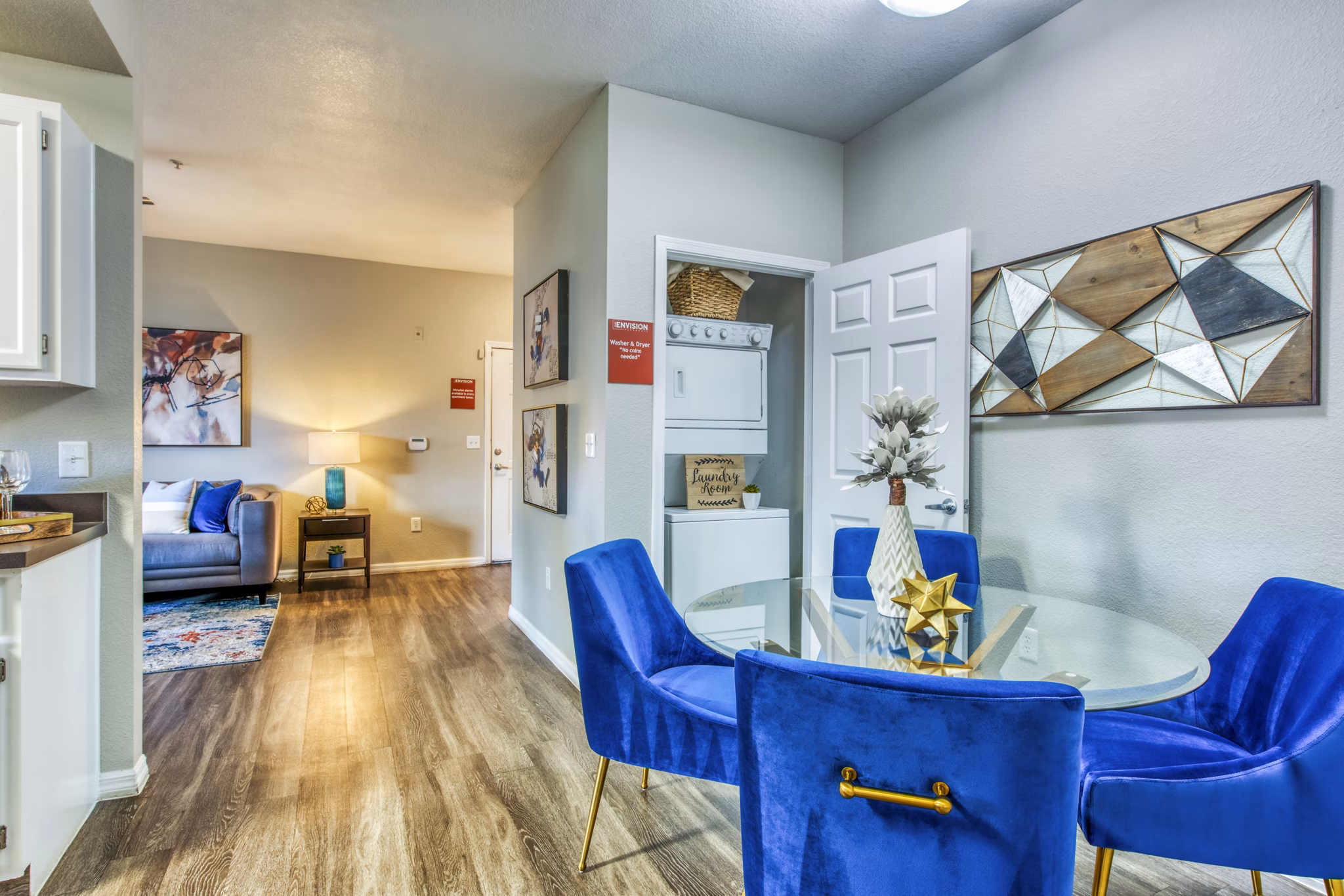 Modern dining room with elegant lighting and stylish decor at Envision Apartments, offering luxury living and a welcoming atmosphere