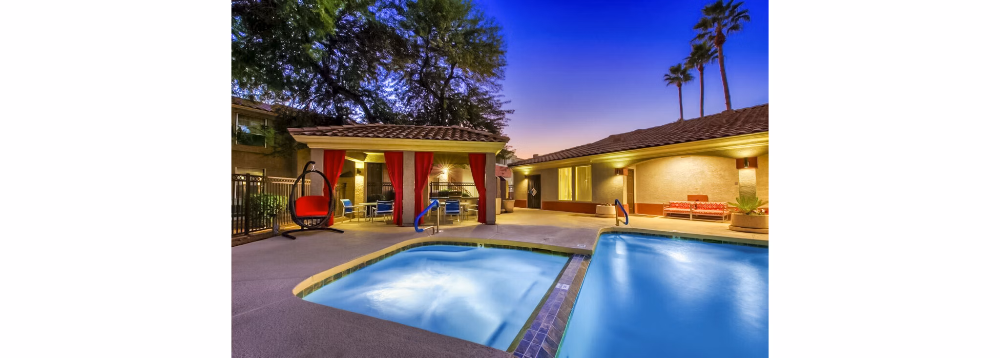 Relaxing outdoor pool with lounge chairs at Envision Apartments, perfect for summer relaxation