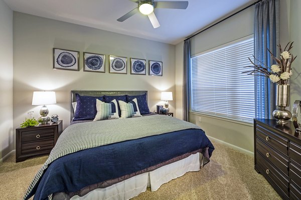 Cozy bedroom with modern decor and natural light in Elan Memorial Park Apartments