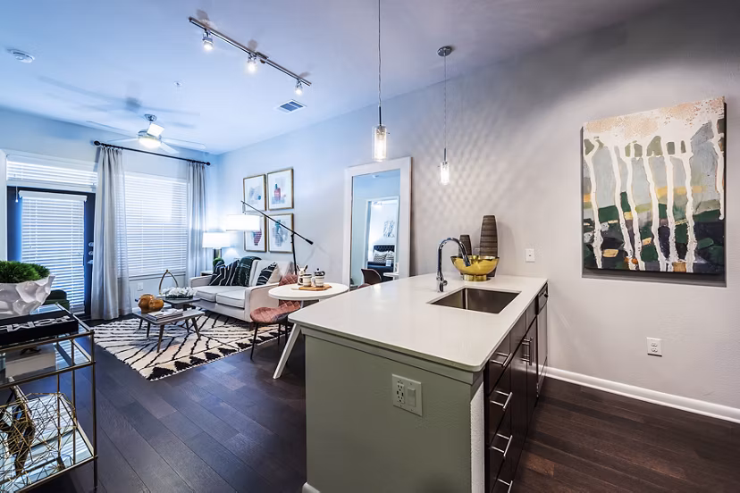 Modern kitchen with sleek appliances and granite countertops at Elan Memorial Park Apartments in Houston