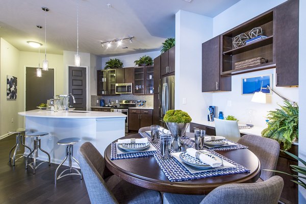Dining room featuring modern furnishings and elegant lighting at Elan Memorial Park Apartments