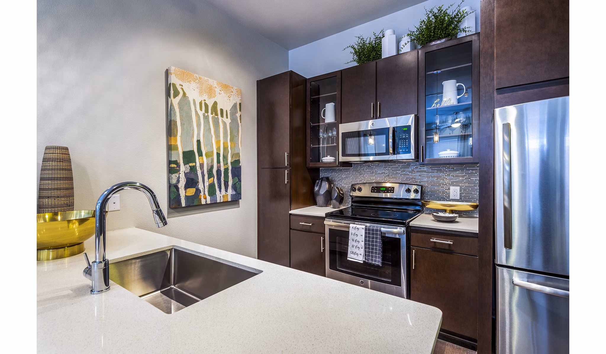 Elan Memorial Park: Modern kitchen with stainless steel appliances in luxury apartments