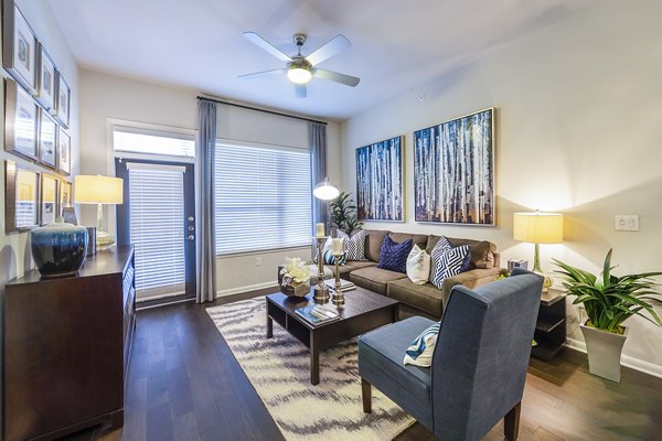 Living room with modern decor and natural light at Elan Memorial Park Apartments