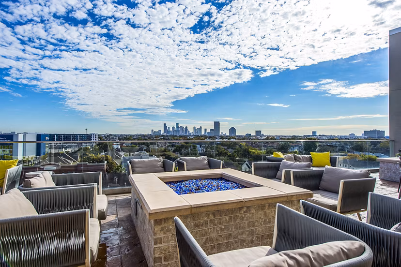 Cozy outdoor seating with fire pit at Elan Memorial Park Apartments
