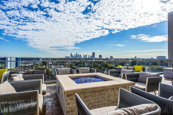 Cozy outdoor seating with fire pit at Elan Memorial Park Apartments
