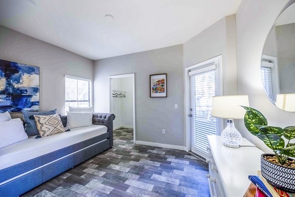 Spacious bedroom with modern decor at Tesoro Ranch Apartments: luxury living with serene ambiance