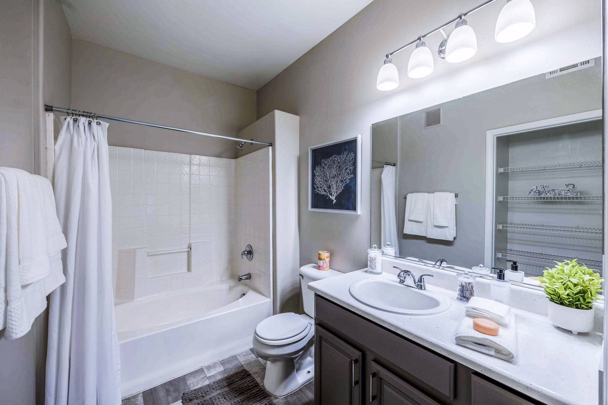 Modern bathroom with sleek fixtures and ample counter space at Tesoro Ranch Apartments