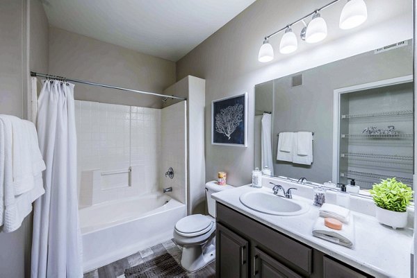 Modern bathroom with sleek fixtures and ample counter space at Tesoro Ranch Apartments