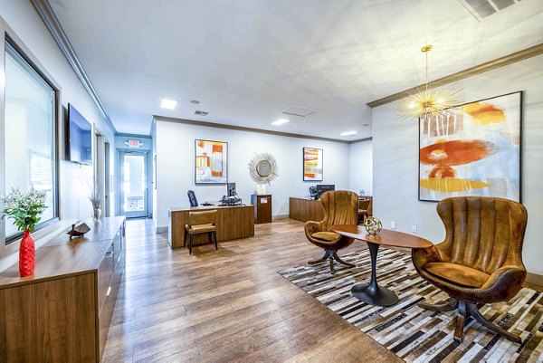 ``` 
Modern clubhouse and leasing office at Tesoro Ranch Apartments with stylish seating and elegant design 
```