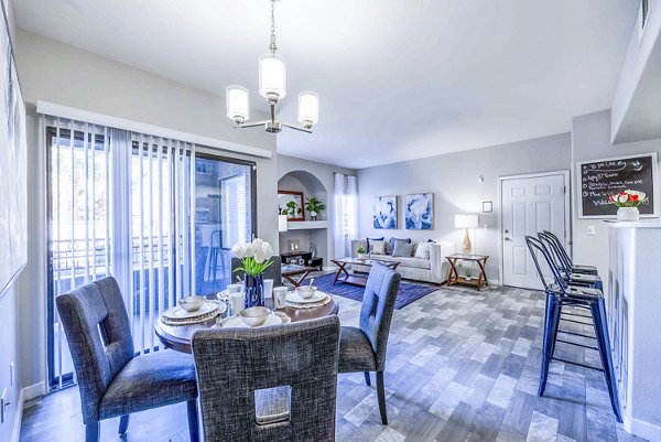 Dining room featuring elegant furnishings and modern lighting at Tesoro Ranch Apartments