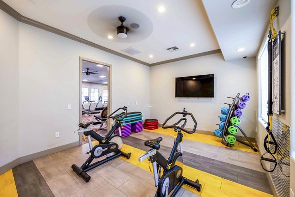 Modern spin studio with high-end bikes at Tesoro Ranch Apartments, perfect for fitness enthusiasts seeking luxury living