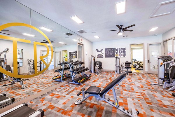 State-of-the-art fitness center with modern equipment at Tesoro Ranch Apartments