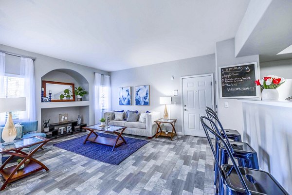 Spacious living room with contemporary furnishings at Tesoro Ranch Apartments