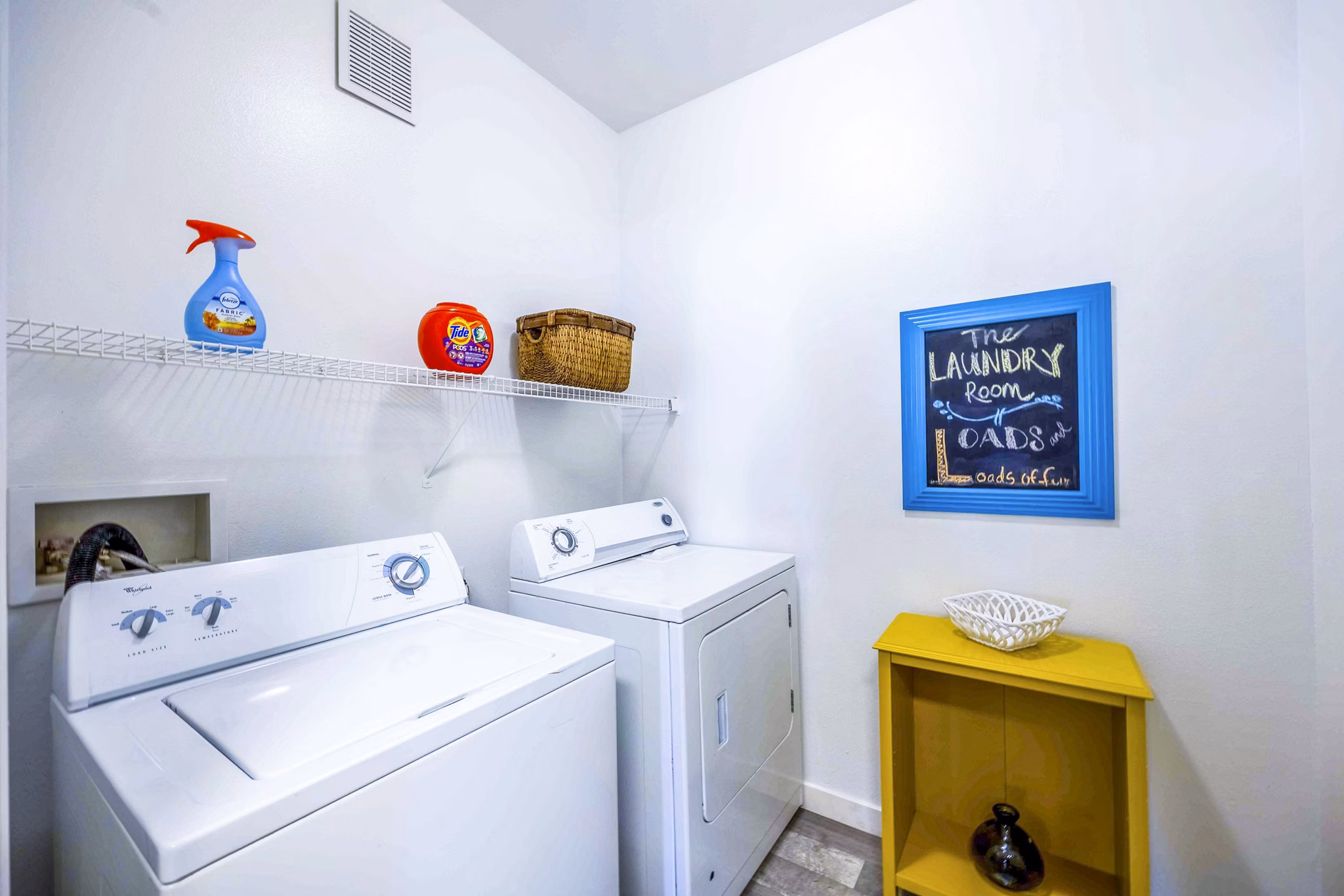 Laundry room with modern appliances at Tesoro Ranch Apartments