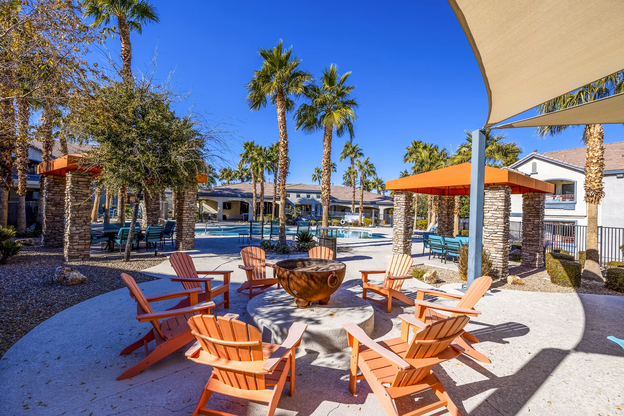 Cozy fire pit area with seating at Tesoro Ranch Apartments, perfect for social gatherings and relaxation