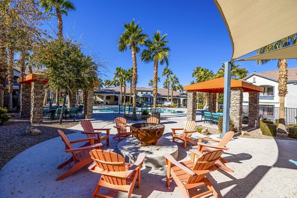 Cozy fire pit area with seating at Tesoro Ranch Apartments, perfect for social gatherings and relaxation
